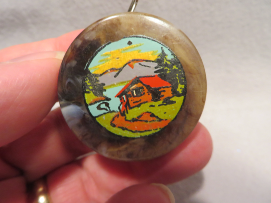 Vintage Miniature "Made in Germany" Plastic Tape Measure Featuring A Rustic Cabin