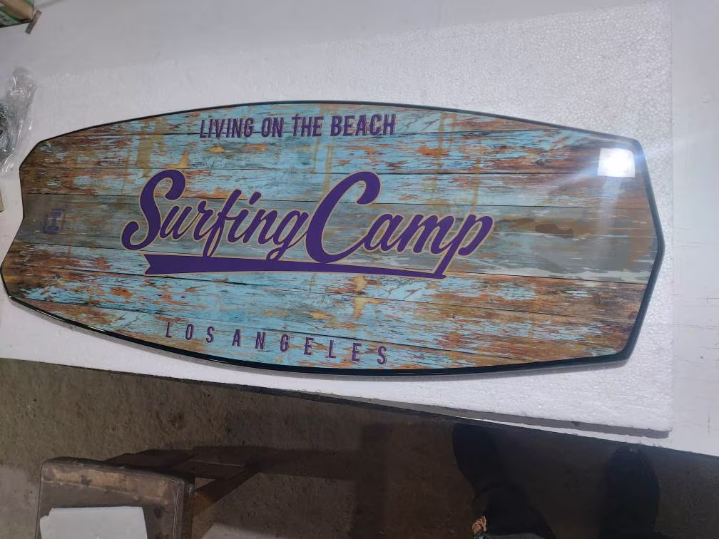 Surfboard Shaped Coffee Table in Nautical Vintage Design Ware Out Effect Wooden Low Blue, White Colors With Surfing Camp Lettering