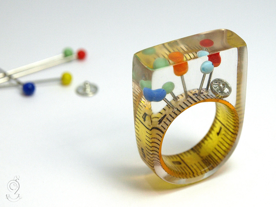 Sewing Basket - Extraordinary Sewing Supplies Ring With Measuring Tape, Colorful Fixing Pins & Snap Fastener On A Yellow Made Of Resin