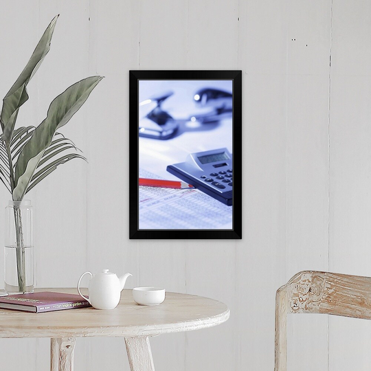 "Pocket calculator and red pencil on spreadsheet" Black Framed Print