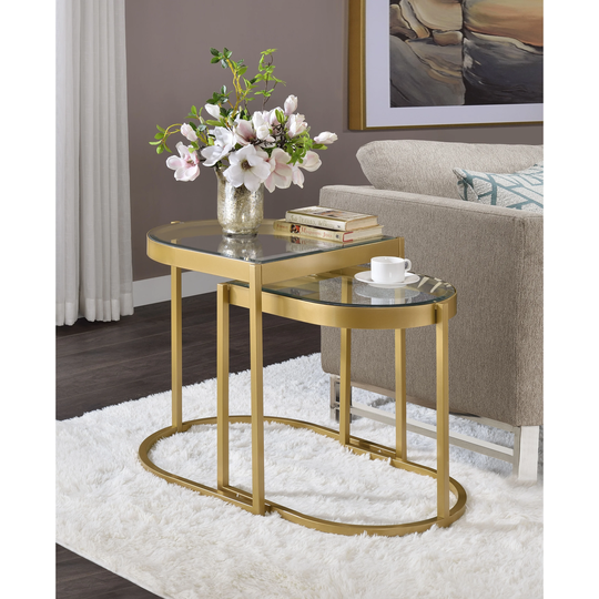 Nesting Table set features half oval shaped table top with metal frame Clear Glass & Gold Finish Metal Base