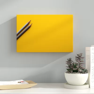 'Pencil on a Yellow Backgournd' Photographic Print on Canvas