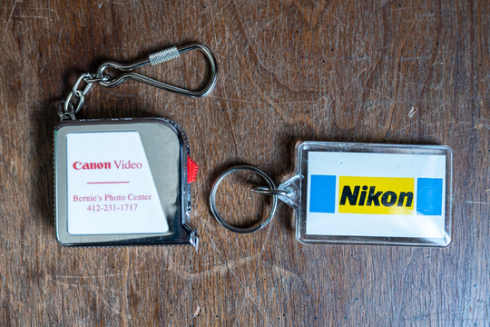 Photo Branded Keychains - Set Of 2 Canon Measuring Tape & Nikon Keychain