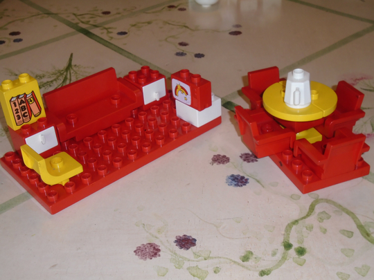 Duplo Living Room, Dining Area. Sofa, Yellow Chair, End Tables Drawers, Tv, Abc Books. Tabletop. Base, 4 Chairs, White Kettle