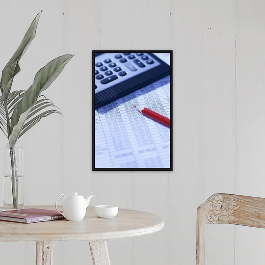 "Pocket calculator and red pencil on spreadsheet" Black Float Frame Canvas Art