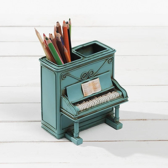 Vintage Decorative Metallic Antique. Piano in Bright Green Color That Serves As A Pencil Case