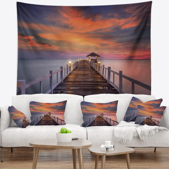 Designart 'Dark Seashore Pier under Colorful Sky' Pier Seascape Wall Tapestry
